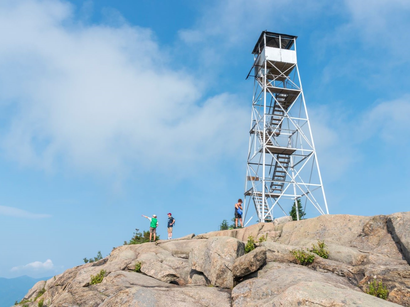 A fire tower with three people